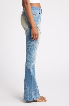 A tie-dye wash and angled seams bring eye-catching appeal to these flared jeans cut from low-stretch denim. 31" inseam; 23" leg opening; 10" front rise; 15" back rise (size 29) Zip fly with button closure Front scoop pockets; back patch pockets 69% cotton, 30% polyester, 1% spandex Machine wash, tumble dry Imported Fitted Distressed Denim Flares, Distressed Fitted Flares For Spring, Fitted Distressed Flares For Spring, Fitted Medium Wash Summer Flares, Summer Fitted Medium Wash Flares, Fitted Medium Wash Flares For Summer, Fitted Acid Wash Denim Bottoms, Fitted Denim Blue Cotton Flares, Fitted Faded Flare Jeans With Frayed Hem