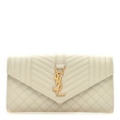 This is an authentic SAINT LAURENT Grain De Poudre Mixed Matelasse Triquilt Large Monogram Wallet in Beige. This wallet is crafted of pebbled chevron and diamond-quilted leather in light beige. The front flap has a prominent gold-toned YSL monogram weighted emblem and opens with a snap to a beige leather interior with card slots and zippered pocket. Saint Laurent Wallet, Quilted Leather, Leather Interior, Light Beige, Card Slots, Slots, Saint Laurent, Grain, Monogram