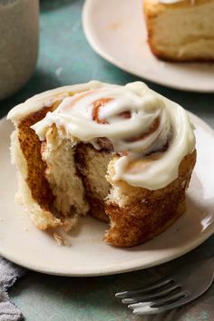 a piece of cinnamon roll with icing on a plate