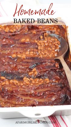 homemade baked beans in a baking dish with a wooden spoon on the side and text overlay