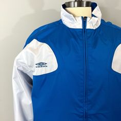 Umbro Full Zip Windbreaker Coach’s Jacket Lightweight Track Futbol Soccer Men Size Xxl Royal Blue & White 100% Polyester New With Tags Long Sleeves - Full Zip - High Collar - Umbro Logo Embroidered At Right Chest - Adjustable Cinch Waist - Pockets Ships Same Day Or Next Business Morning Soccer, Umbrosoccer, Starter, Track Jacket, Grand Collection, Retro, Striker, Rave, 80’s, Vintage, Deadstock, Training, Football Futbol Fifa Futebol Sport Calcio Premierleague Messi Championsleague Ronaldo Sporty White Sport Coat For Outdoor, White Track Jacket For Sports Season, White Track Jacket For Outdoor Sports Season, Sporty Long Sleeve Outerwear For Team Events, Sporty Long-sleeve Outerwear For Team Events, White Sports Outerwear, White Functional Windbreaker For Sports Events, Sporty White Sport Coat, White Track Jacket For Winter Sports Events