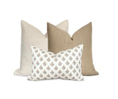 three pillows with different patterns on them