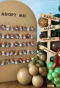 an animal themed birthday party with balloons, decorations and animals on the wall for each guest