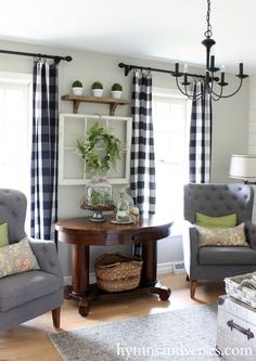 a living room with two chairs and a table