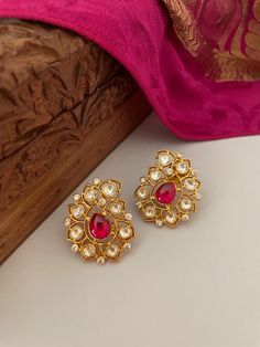 A great addition to your invaluable jewelry collection! Feel the romance blossoming in this dainty red kundan earrings accented with kundan and CZ stones.  Details: Earrings Length-1.25 Inches Weight of Each Earring-5 grams All products are manufactured using traditional skills from our rich heritage of crafts.  The process of these crafts is essentially manual. Hence, any irregularities or variations are an inherent part of these handcrafting processes. Wedding Jewelry Indian, Paisley Earrings, Earrings Kundan, Cocktail Earrings, Red Studs, Kundan Earrings, Indian Wedding Jewelry, Jewelry Indian, Earrings Red