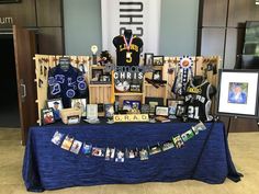 the table is covered with pictures and memorabilia for fans to see on their team's shirts