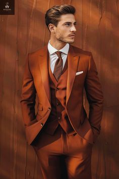 Introducing our exquisite Men's Three Piece Wedding Suit in a sophisticated rust color, designed to elevate your special day with timeless elegance. This ensemble includes a tailored jacket, classic trousers, and a basic vest, all meticulously crafted to ensure you look your absolute best on your wedding day. The jacket features a modern notched lapel, adding a touch of contemporary style to the traditional silhouette. The rust color exudes warmth and richness, making it a standout choice for a Copper Groom Suit, Rust Wedding Suit Groom, Mens Suits For Fall Wedding, Copper Tuxedo Wedding, Rust Suit Men, October Wedding Mens Suits, Terracotta Suit Wedding, Groom Colored Suit, Terracotta Wedding Suit