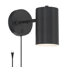 a black wall light with a white shade