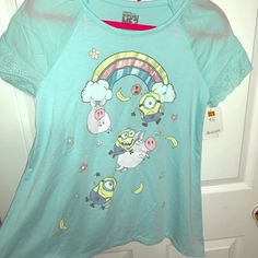 Nwt Girl’s Despicable Me Flowy Top In A Light Blue Color With Eyelet Sleeves. Fun Cotton Tops For Bedtime, Multicolor Short Sleeve Bedtime Top, Playful Blue Top For Sleepovers, Playful Blue Tops For Sleepover, Playful Blue Top For Sleepover, Spring Cartoon Print Tops For Sleepover, Cartoon Print Tops For Spring Sleepover, Cartoon Print Tops For Sleepover In Spring, Cartoon Print Tops For Sleepover, Spring Season