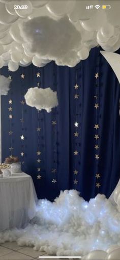 a room with clouds and stars on the ceiling