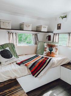 a bedroom with a bed and pillows in it