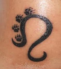 the foot and paw tattoo is shown in black ink