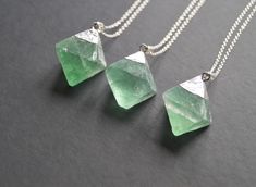 You will receive (1) green fluorite necklace. Size approx : 50mmx38mmx38mm The chain is sterling silver. Please select your length at checkout. You necklace will come in a gift box or a gift bag ready for gifting.  Feel free to contact me if you have any questions. Green Sterling Silver Crystal Necklaces With Gemstone, Green Sterling Silver Crystal Gemstone Necklaces, Green Sterling Silver Crystal Necklace With Gemstone, Silver Fluorite Jewelry As A Gift, Faceted Green Crystal Necklace For Gift, Bohemian Fluorite Crystal Necklace As A Gift, Fluorite Pendant Necklace For Gift, Green Sterling Silver Pendant Crystal Necklace, Spiritual Fluorite Gemstone Crystal Necklace