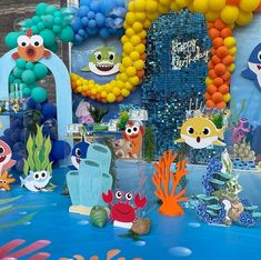 an under the sea themed birthday party with balloons and decorations