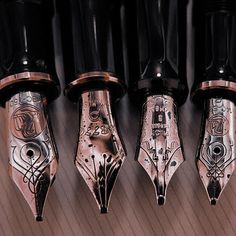 five different types of fountain pens lined up in a row on top of each other