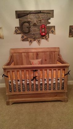 the baby crib is made out of wood