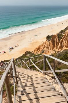 stairs lead down to the beach and ocean