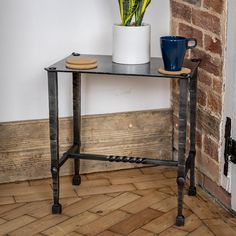 a table with a potted plant next to it