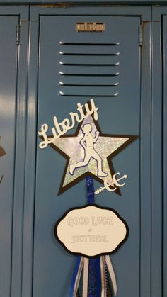 a blue locker with a sign that says liberty good luck and a star hanging from it