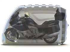 an image of a motorcycle in the back of a vehicle with it's doors open