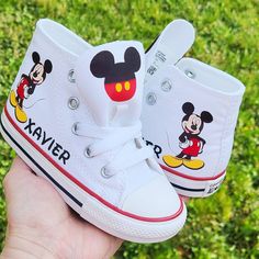 White high top genuine Converse with Mickey Mouse and your little one's name on them! To visit my entire etsy shop and see all 200 of my items, please click here: cloversaigestudio.etsy.com Mickey Mouse Sneakers, White Personalized Sneakers As Gift, White Personalized Sneakers For Gift, Personalized White Sneakers As Gift, Personalized White Sneakers For Gifts, Customizable White Fun Sneakers, Customizable Fun White Sneakers, Customizable High-top Sneakers For Gifts, Customizable High-top Sneakers For Gift