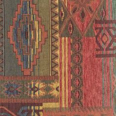 an old rug with many different colors and patterns