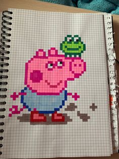 a notebook with a drawing of peppa pig on it