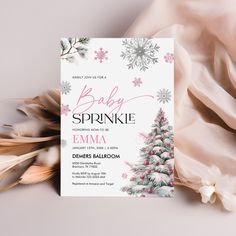 a baby sprinkle is on top of a pink and white christmas tree card