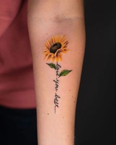 a woman's arm with a sunflower and the words, i love you