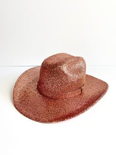 Add some sparkle to your wild west look with this Western Cowboy Glitter Hat! The rose gold design brings a touch of glamour to your rugged style. Perfect for standing out in any saloon or rodeo (yeehaw!). GlitteryColor: Rose Gold- durable stiff brim- 3" brim- one size fits most (elastic inner band to fit S, M, L - 55cm-59cm).- handmade item.*Product color and quality as seen on a monitor may vary slightly compared to actual items due to photography lighting conditions and individual screen colo Glitter Hat, Western Glam, Statement Hat, Suede Hat, Boho Cowgirl, Western Accessories, Cowgirl Chic, Rugged Style, Photography Lighting