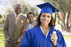 a group of people standing around each other in graduation gowns