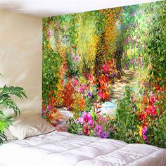 a bed room with a large painting on the wall next to a planter filled with flowers