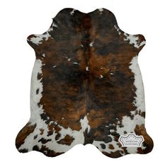 a brown and white cowhide rug on a white background