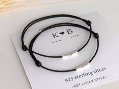 two bracelets are sitting on top of a card with the words, ko b sterling silver get lucky style