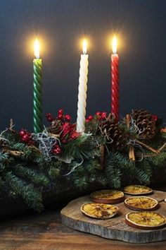 a table topped with pies and lit candles