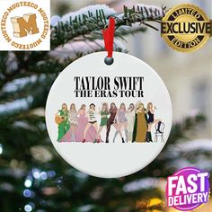 a white ornament hanging from a christmas tree with the words taylor swift, the brats tour on it