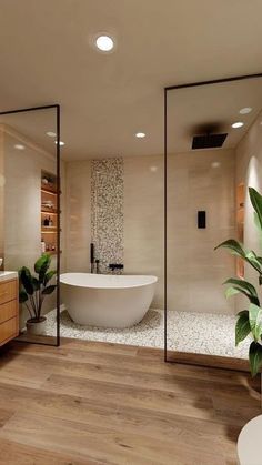 a bathroom with a large tub, sink and mirror on the wall next to it