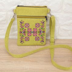 Introducing our stylish Chartreuse Cloth Crossbody Bag - the perfect accessory for women on the go! Crafted with convenience and fashion in mind, this travel-friendly crossbody bag is both practical and chic. Featuring a vibrant chartreuse hue and delicate embroidery, this bag adds a pop of color and personality to any outfit. Its compact yet spacious design makes it ideal for carrying your essentials, including your cell phone, wallet, keys, and more. With multiple zippered compartments, includ Green Crossbody Phone Bag With Zipper Closure, Green Crossbody Phone Bag With Zipper, Green Embroidered Crossbody Shoulder Bag, Embroidered Shoulder Bag Pouch For Travel, Embroidered Crossbody Shoulder Bag For Travel, Embroidered Cross, Delicate Embroidery, Cell Phone Purse, Red Embroidery