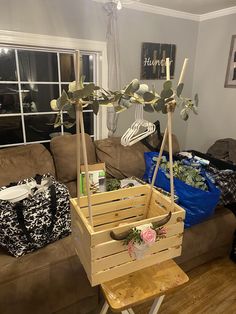 a living room filled with furniture and lots of clutter on top of a wooden table