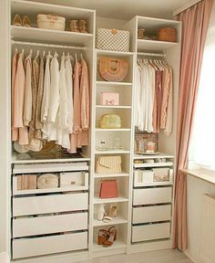 an organized closet with clothes, shoes and handbags on the shelves in front of it