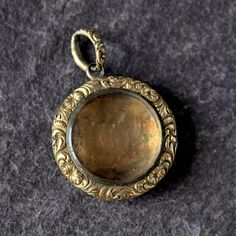 A wonderful antique English, genuine Georgian period locket fob pendant. Made of a thick layer of 9 carat gold over a base metal core, it has very fine floral hand chased and engraved decoration throughout, an engine turned back and its original fitted, chased bale ring. Its rounded, glazed locket compartment is currently empty and easily accessed to place a photo or other memento if desired. It dates from around 1800/10 and is in good condition throughout, with some thinning to the top ring. It weighs 5.8 grams and measures 1 inch in diameter. All my items are guaranteed 100% as described or your money back, so buy with confidence! What's more, I offer layaway deals so there's no need to let any of my listings slip through your fingers - just ask! For security all items are stored in a ba Safe Deposit Box, Metal Core, Top Rings, Gold Locket, Locket Necklace, Base Metal, Locket, Antique Jewelry, Favorite Jewelry