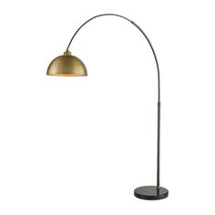 a floor lamp that is on top of a table next to a white wall with a black base