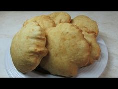 three pieces of bread sitting on top of a white plate