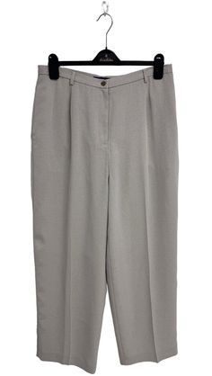 These women's pants are a stylish addition to any wardrobe.  Pair them with your favorite top and shoes for a complete outfit.  The pants are perfect for casual or dressy occasions and are comfortable to wear.  They have a classic design and are made from high-quality materials that are durable and long-lasting.  Plus, they are easy to care for and can be machine washed.  Get these pants today and elevate your wardrobe! Size: 14 Measurements approx.:  All measurements are taken with garment flat and doubled when necessary. Waistline:32 "Inches Hips: 46"Inches Rise:13.5 "Inches Inseam: 30"Inches  Please see photos and measurements for exact condition and details,  every designer has different standards for sizing. We will combine shipping cost. We try our best to give the exact color in the Gray Ankle Dress Pants For Spring, Gray Tapered Leg Dress Pants For Spring, Classic Solid Summer Dress Pants, Spring Office Wide Leg Pants In Relaxed Fit, Gray Wide Leg Pants For Spring Workwear, Classic Office Pants For Spring, Gray Straight Dress Pants For Spring, Classic Ankle-length Wide Leg Pants For Spring, Classic Spring Office Pants