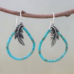 A sterling feather adverts the presence of a majestic bird. Beads of reconstituted turquoise evoke the sky in elegant earrings by Srimuang. .925 Sterling silver Bird Beads, Silver Dangle Earrings, Sterling Silver Dangle Earrings, Silver Earrings Dangle, Artisan Craft, Turquoise Earrings, Elegant Earrings, Hook Earrings, The Sky