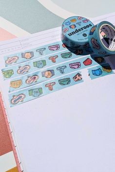 bobo design studio's underoos washi tape placed on a wanderlust passport travel journal