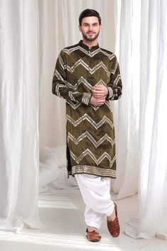 Olive kurta with threadwork chevron patterns, embellished by mirrorwork. Comes with patiala. - Aza Fashions Unstitched Gota Work Kurta For Ceremonial Occasions, Ceremonial Gota Work Kurta, Eid Kurta With Multicolor Embroidery And Mirror Work, Ceremonial Straight Kurta With Mirror Work, Transitional Ceremonial Kurta With Mirror Work, Ceremonial Unstitched Kurta With Mirror Work, Unstitched Ceremonial Kurta With Mirror Work, Ceremonial Kurta With Mirror Work For Transitional Season, Multicolor Embroidered Kurta With Mirror Work For Festive Occasions