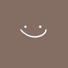 a smiling face on a brown background