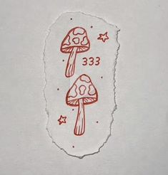 a piece of paper with a drawing of two mushrooms on it