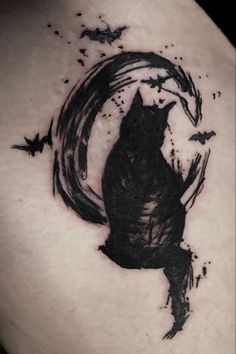 a black cat sitting on top of a person's back with bats flying around it